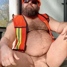 Photo by Nickplus33 with the username @Nickplus33, who is a verified user,  May 3, 2024 at 3:30 AM and the text says '#beefy #bear #hairy #beard #shades #manspread  #tradie'