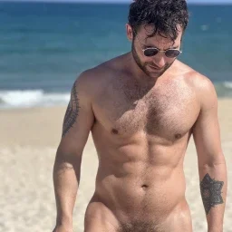 Photo by Nickplus33 with the username @Nickplus33, who is a verified user,  May 7, 2024 at 3:40 AM and the text says '#outdoors #shades #beach #youngdilf #toned #scruff  #bush #thickbush'