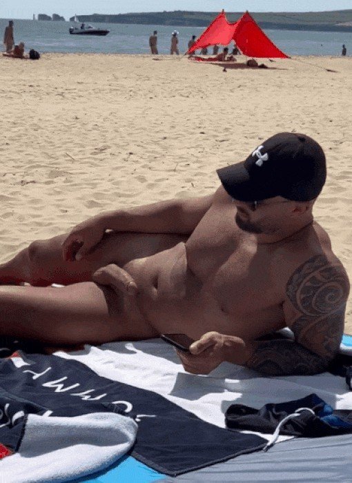 Photo by Nickplus33 with the username @Nickplus33, who is a verified user,  March 14, 2024 at 2:36 AM and the text says '#outdoorcruising #muscled #hung #massivecock #uncut  #spear #beard #shades #caps #beach #ink #gif'