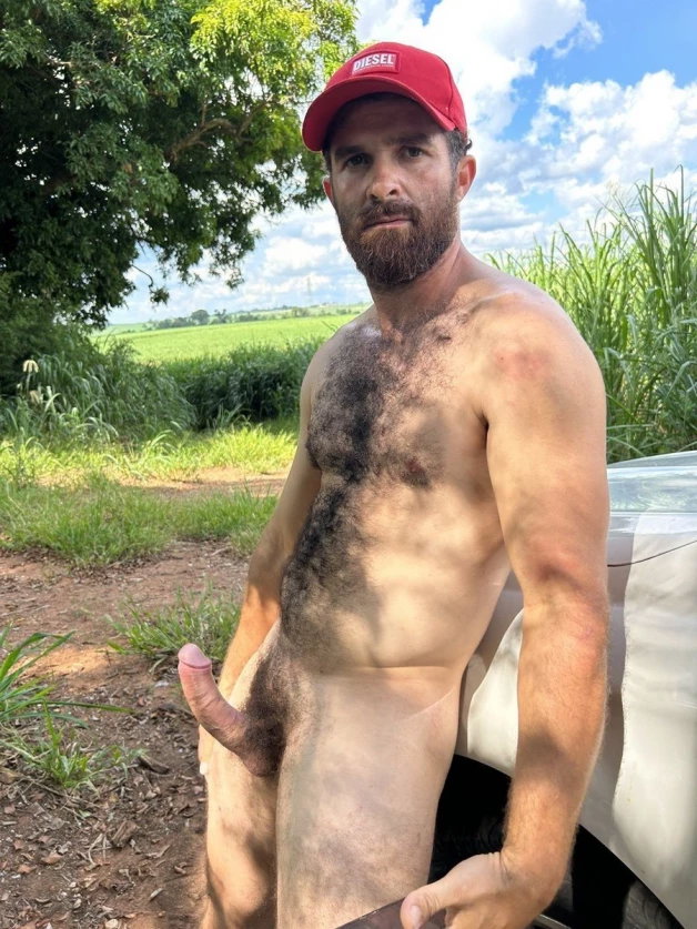 Photo by Nickplus33 with the username @Nickplus33, who is a verified user,  March 22, 2024 at 2:34 AM and the text says '#hairy #dilf #outdoors #outdoorcruising #hung #curved #beard #bush'