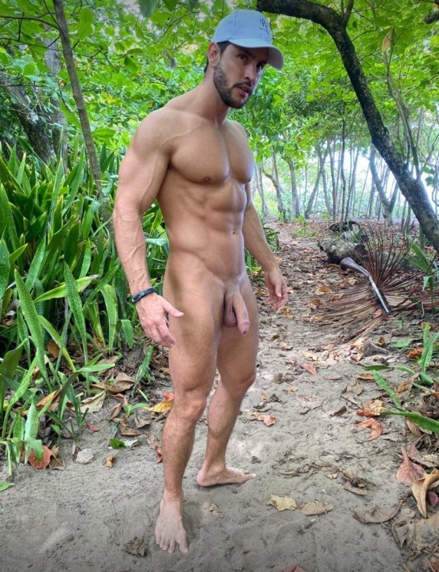 Photo by Nickplus33 with the username @Nickplus33, who is a verified user,  October 31, 2023 at 3:46 AM and the text says '#muscled #youngdilf #beard #caps #uncut #cruisingoutdoors #outdoorcruising'