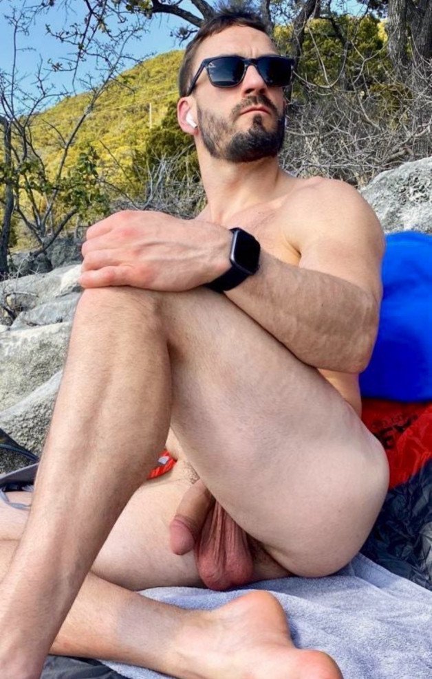 Photo by Nickplus33 with the username @Nickplus33, who is a verified user,  April 20, 2024 at 2:19 AM and the text says '#outdoors #outdoorcruising #shades #dilf #manspread  #hung #balls #lowhangers  #beard'