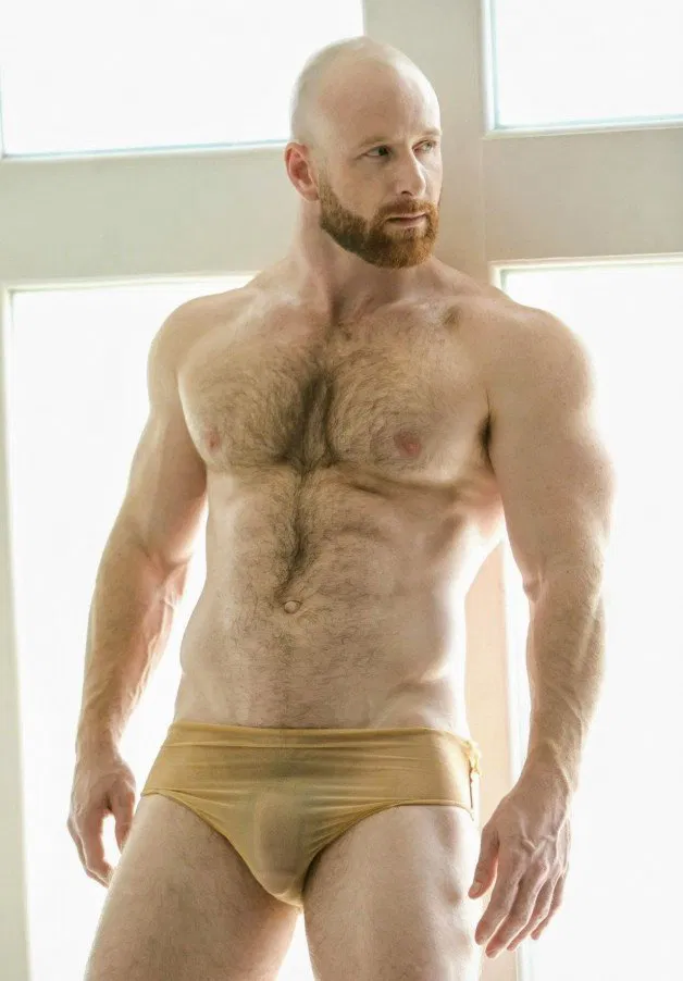 Photo by Nickplus33 with the username @Nickplus33, who is a verified user,  July 12, 2024 at 2:40 AM and the text says '#bald #ginger #hairy #dilf #bulge #hairy #toned'