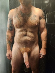 Photo by Nickplus33 with the username @Nickplus33, who is a verified user,  May 26, 2024 at 3:53 AM and the text says '#shower #ginger #daddy #dilf #hairy #hairychest #hung #massivecock #longdick #schlong  #thickbush #ink'