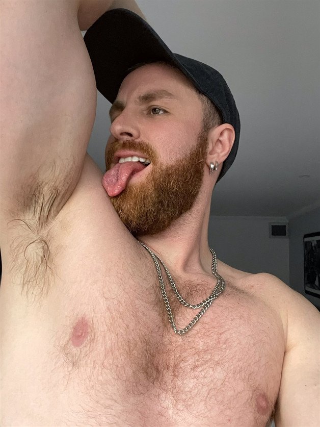 Photo by Nickplus33 with the username @Nickplus33, who is a verified user,  July 9, 2024 at 2:15 AM and the text says '#ginger #otter   #beard #tongue #chain #hairy #hairychest'