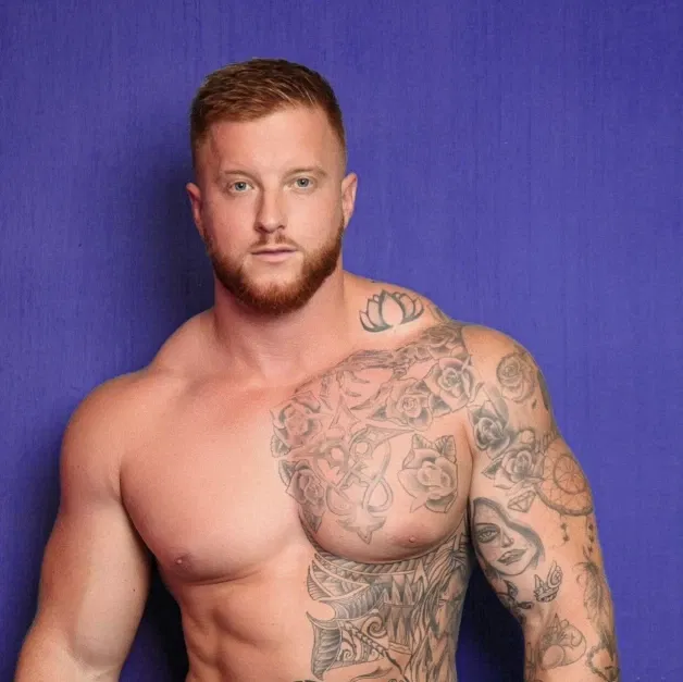 Photo by Nickplus33 with the username @Nickplus33, who is a verified user,  April 1, 2024 at 3:50 AM and the text says '#ginger #muscled #ink #smooth #stud #beard'