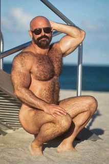 Photo by Nickplus33 with the username @Nickplus33, who is a verified user,  January 19, 2024 at 1:43 AM and the text says '#beefy #toned #daddy #bald #dilf #hairy #shades #outdoors #beach #outdoors'