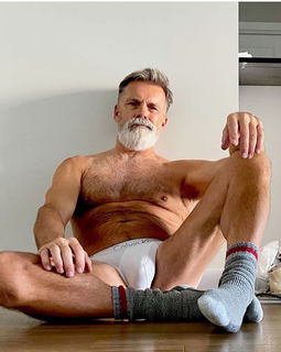 Photo by Nickplus33 with the username @Nickplus33, who is a verified user,  July 10, 2024 at 2:05 AM and the text says '#manspread  #daddy #granddaddy #silverfox #beard #bulge #tightywhities #hairychest #hairy'