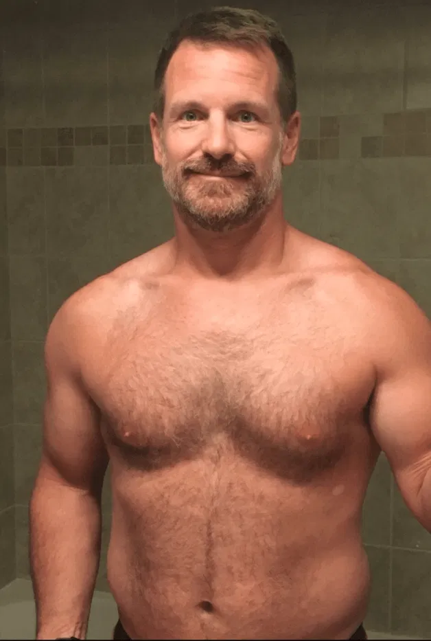 Photo by Nickplus33 with the username @Nickplus33, who is a verified user,  March 15, 2024 at 2:47 AM and the text says '#daddy #hairy #beard #toned'