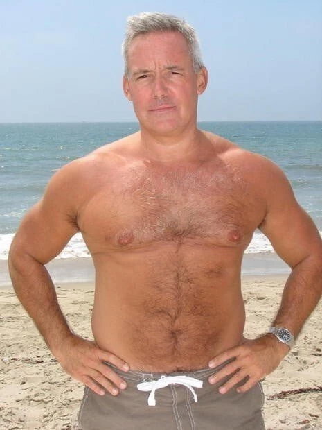 Photo by Nickplus33 with the username @Nickplus33, who is a verified user,  May 8, 2024 at 5:25 AM and the text says '#beefy #hairy #beach #outdoors #daddy #hairychest'