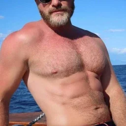 Photo by Nickplus33 with the username @Nickplus33, who is a verified user,  May 7, 2024 at 2:40 AM and the text says '#shades #daddy #dilf #beard #toned #hairy #trimmed  #outdoors'
