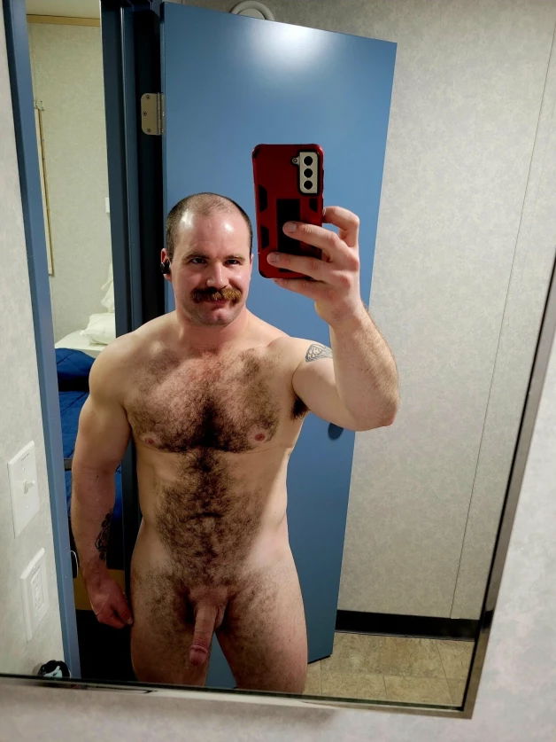 Photo by Nickplus33 with the username @Nickplus33, who is a verified user,  April 2, 2024 at 3:45 AM and the text says '#dilf #dimple #selfie #hairy #bald #stache #toned #longdick #hung'