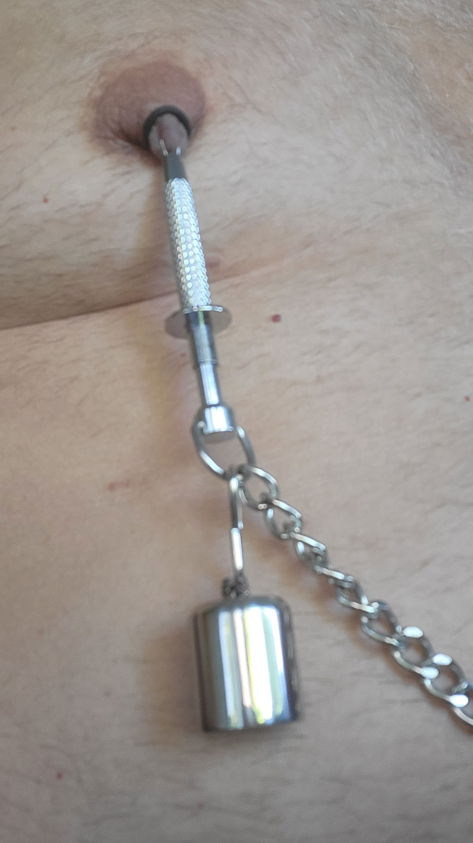 Album by Chastity Chub with the username @chastity-chub,  June 16, 2023 at 8:40 AM. The post is about the topic Male Chastity and the text says 'On some days I need some pain to get horny. My sensitive nipples are a good target for some torture'