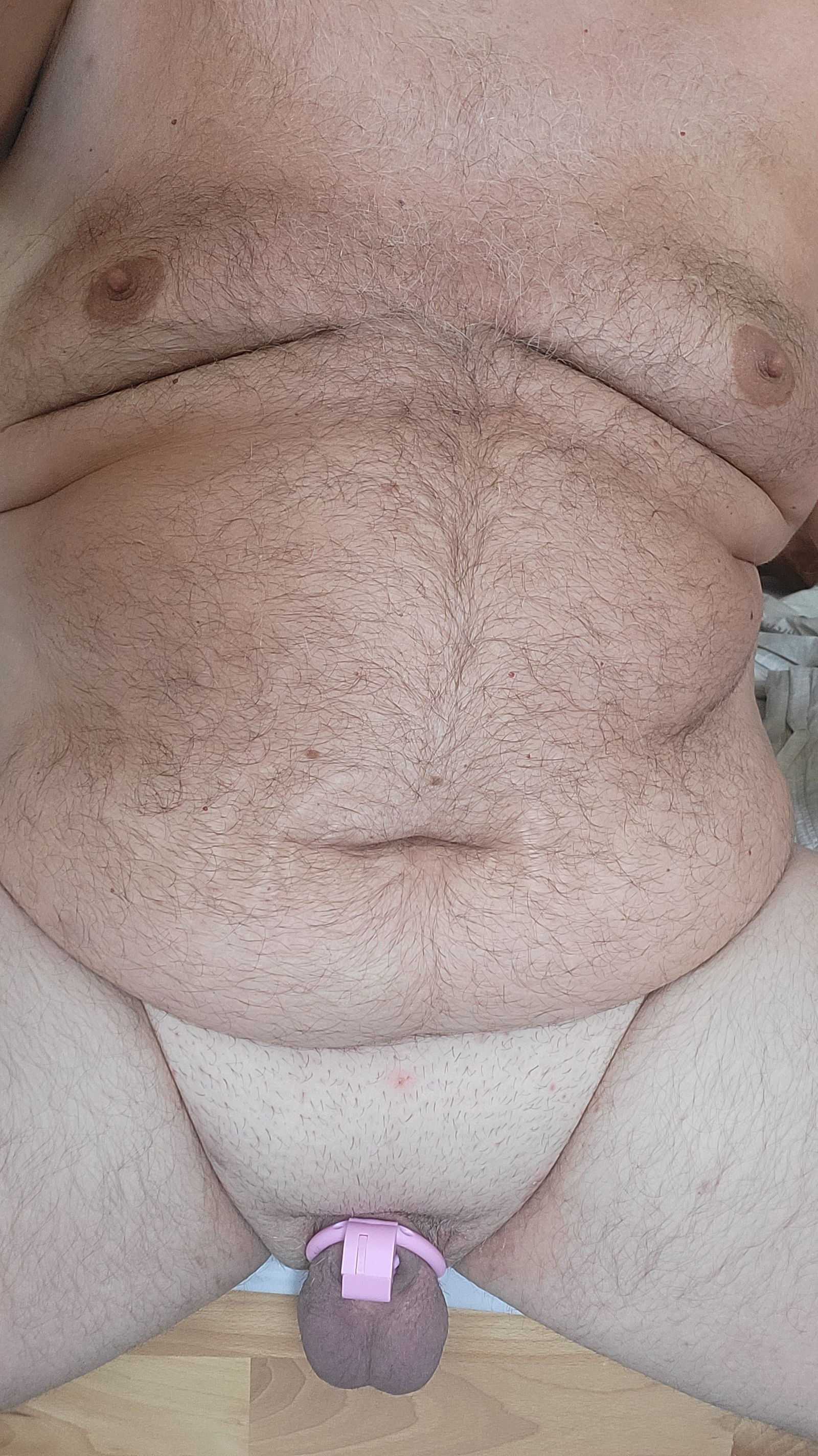 Photo by Chastity Chub with the username @chastity-chub,  June 8, 2023 at 5:16 PM. The post is about the topic Male Chastity and the text says 'This is my lovely pink negative cage. It pushes my nub into my belly consequently. Incredible feelings included... 😉😎'