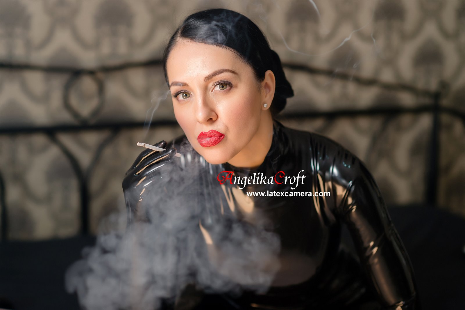 Photo by LatexAngel with the username @LatexAngel, who is a star user,  July 27, 2020 at 8:48 PM and the text says 'Wearing black latex catsuit on https://www.latexcamera.com is hot, but coupled with smoking, it is pure enchantment.

See Me live now, only here:
https://www.latexcamera.com/chat/AngelikaCroft
https://www.sexualeve.com/models/fetish/#angelnoble..'