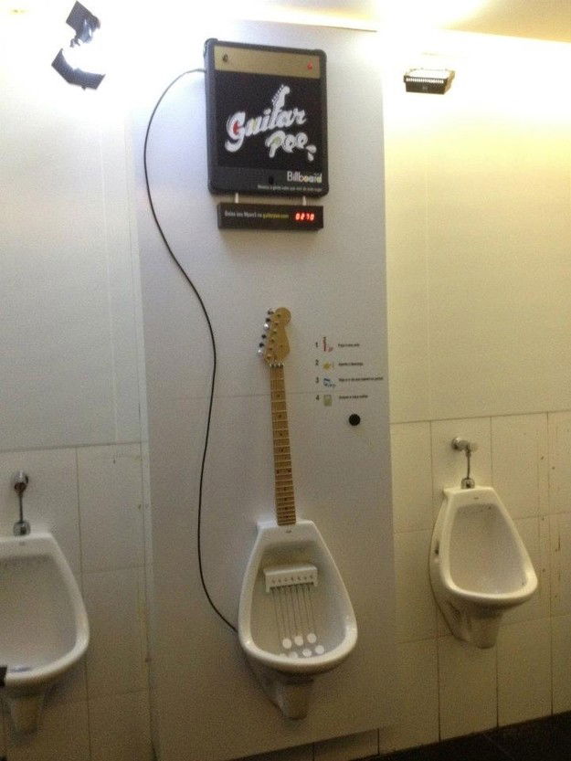 Photo by Swingtastic Toys with the username @swingtastic,  April 4, 2012 at 5:17 PM and the text says 'Water sports anyone? #pissing  #guitar  #hero  #rock  #band  #billboard  #magazine  #water  #sports'