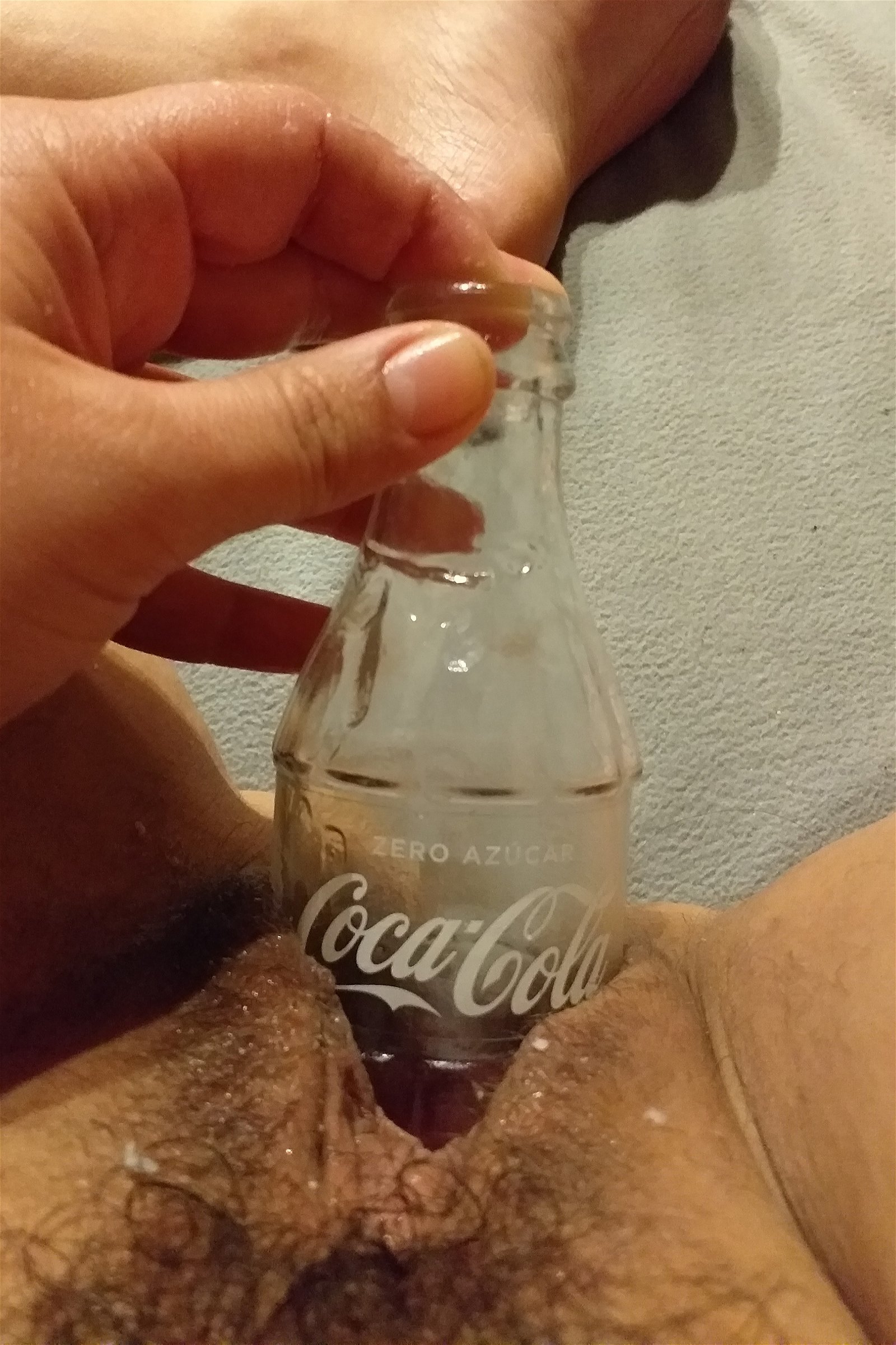 Photo by whore-hole with the username @whore-hole, who is a verified user,  February 2, 2019 at 5:50 PM. The post is about the topic Odd Insertions and the text says 'My first time playing with a little glass coke bottle! :) I love it! I love how smooth the glass is, it slides in so good! It's my new favourite toy. Got me very wet, as you can see. :)'