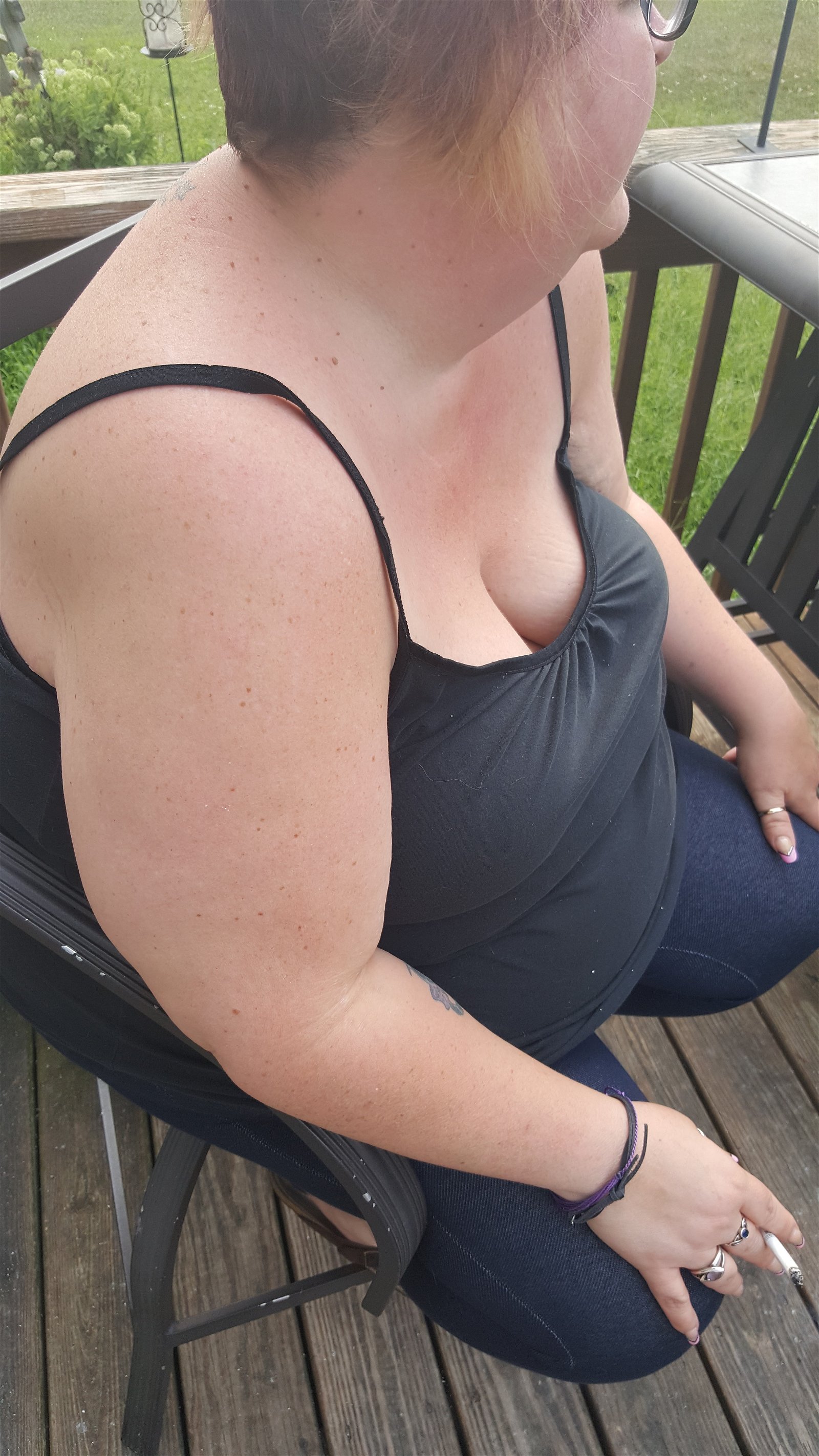 Photo by Dawn42D with the username @Dawn42D,  July 27, 2017 at 10:39 AM and the text says 'Sexy bbw wife having her morning cigarette. Look at her amazing cleavage! #smoking  #smoking  #bbw  #smoking  #wife  #sexy  #downblouse  #unaware  #wife  #smoking  #fetish  #cleavage  #big  #tits  #big  #naturals  #big  #hangers  #cigarette  #smoking..'