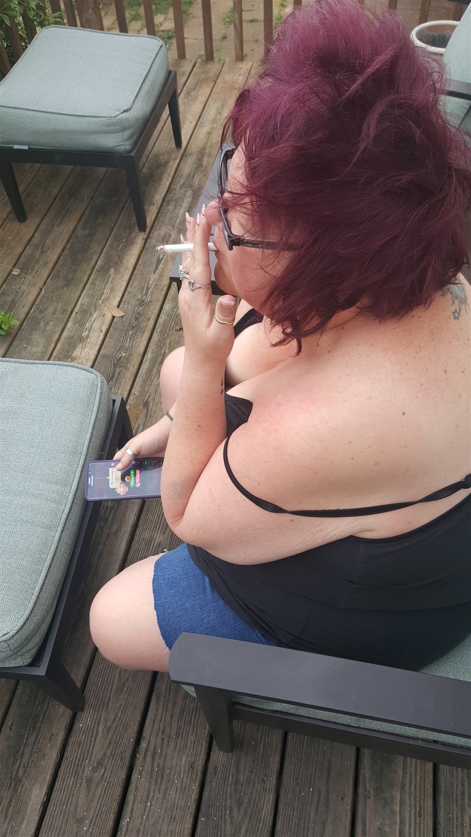 Photo by Dawn42D with the username @Dawn42D,  July 28, 2017 at 1:56 PM and the text says 'I love watching the Mrs smoke. She has some serious sex hair going on in these. #bbw  #bbw  #wife  #smoking  #smoking  #wife  #smoking  #fetish  #cleavage  #downblouse  #unaware  #wife  #sex  #hair  #don't  #care  #WVHotBBW  #wvhb  #Dawn42D'