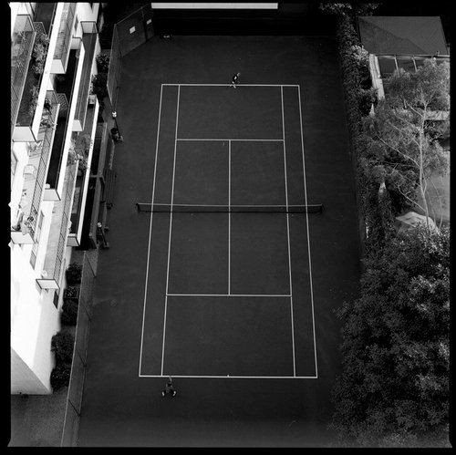 Photo by Sable with the username @SablexXx, who is a verified user,  June 4, 2011 at 2:42 PM and the text says '#Black  #and  #White  #Architecture  #Tennis  #Aerial'