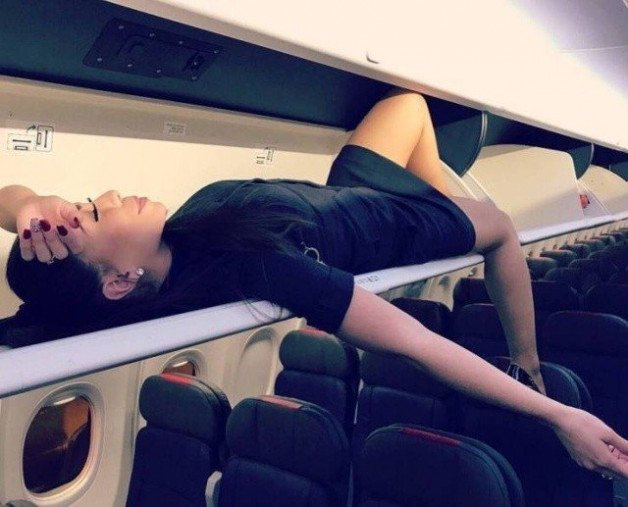 Photo by Ruinedcarpet with the username @Ruinedcarpet,  April 8, 2021 at 9:20 PM and the text says '#Funny #Stewardess #Plane #Uniform #Laying #Babe #Nylon #Stockings #FlightAttendant #Skirt #Hot #Fantasy #Makeup #Beauty'
