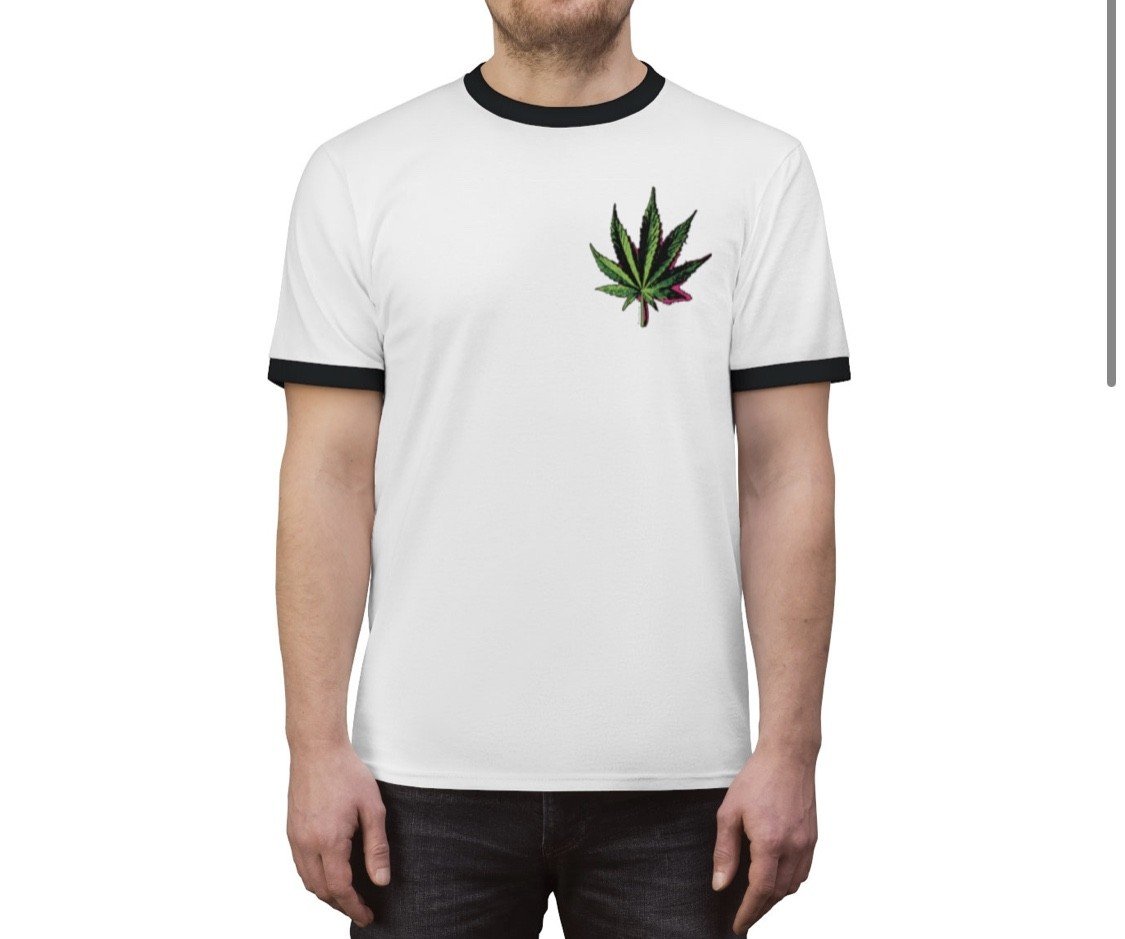 Photo by PolyAnnieStudios with the username @PolyAnnieStudios, who is a star user,  November 10, 2019 at 5:31 PM. The post is about the topic Cannabis and the text says 'Poly Pot Leaf Shirt!! 
💚✨
https://polyanniestudios.patternbyetsy.com/listing/737883658/cannabis-leaf-unisex-ringer-tee'
