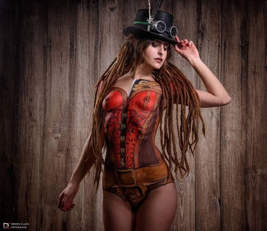 Photo by TheWhiteLight with the username @TheWhiteLight,  January 22, 2018 at 7:40 PM and the text says 'steampunk-lover:

Some hotness for you in the new year.
@eyra_kendra 
Bodypaint by Claude De Buck
Photo: @dennisclaesfotografie 
.
.
.
#steampunk #bodypaint #dreadshare #dreadication #dreadsworld #mydreadslife #dreadication #wonderlocks #loveandpeace_page..'