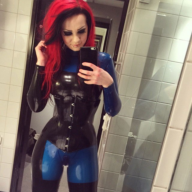 Photo by JoonasD6 with the username @JoonasD6,  January 26, 2015 at 4:28 PM and the text says 'starfucked:

Mirror selfie  Wearing catsuit from #madduckdesigns corset from #houseofharlot  #latex #rubber #catsuit #corset #stayups #redhair #redhead #fetisch #fetishmodel #starfucked'