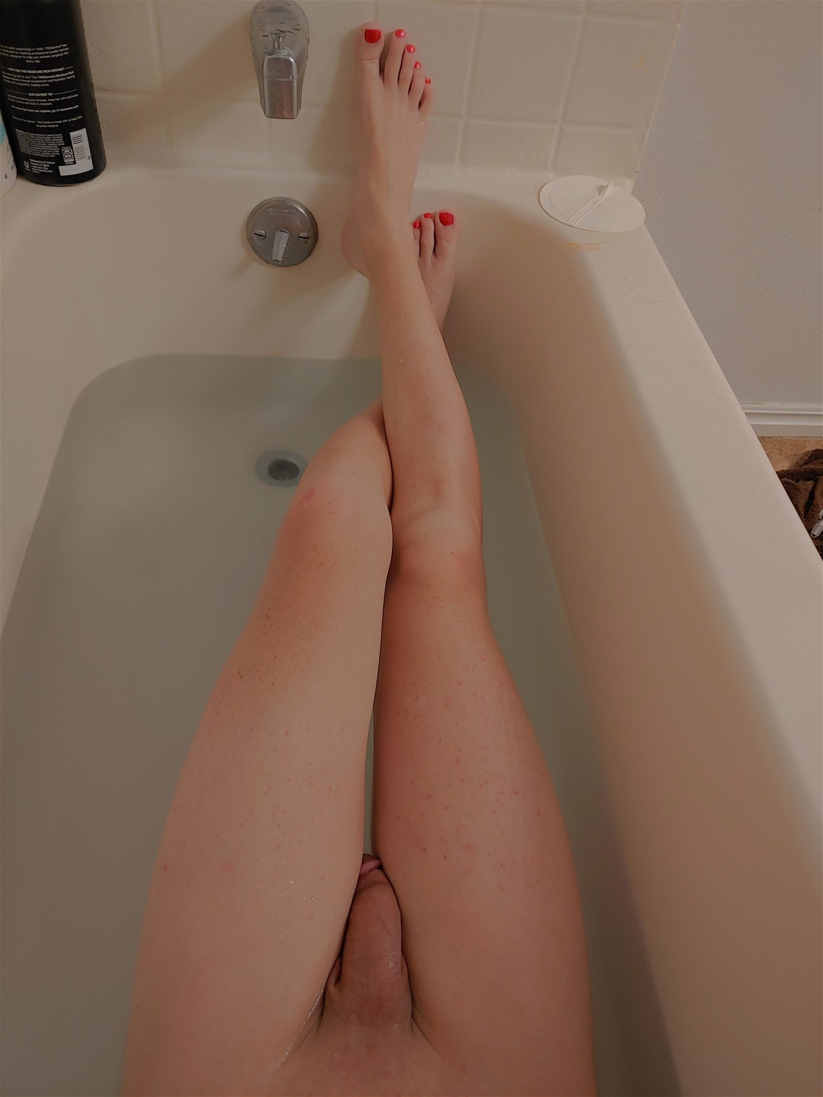 Photo by eMTee with the username @MissTrippy,  December 30, 2020 at 12:21 AM. The post is about the topic Trans Feet and the text says 'Long cherry tipped toes
perched on feet so far away.
A preview of spring.
#lannaJade #haiku'