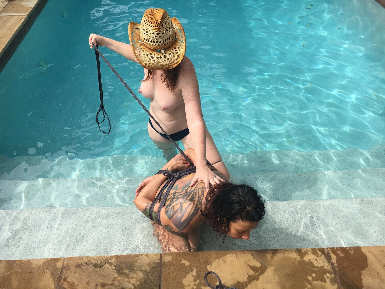Photo by KinkyLotus with the username @KinkyLotus, who is a star user,  December 6, 2018 at 1:47 AM. The post is about the topic Wet and the text says 'KinkyLotus tying Ms. YET by the pool
Image by Traci Matlock'