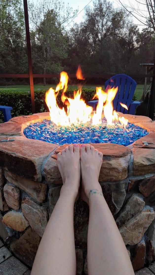 Photo by SexWithMilfStella with the username @SexWithMilfStella, who is a star user,  April 2, 2024 at 10:00 PM. The post is about the topic Foot Fetish and the text says '“The difference between a good life and a bad life is how well you walk through the fire.” – Carl Jung #stellahere #petite #smallfeet #cutefeet #paintedtoenails #tattoo #fire #flames'