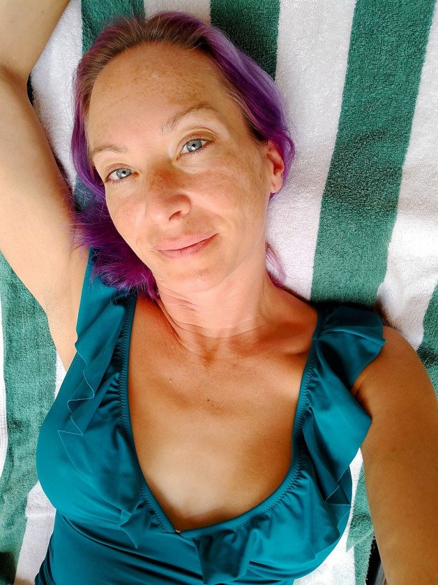 Photo by SexWithMilfStella with the username @SexWithMilfStella, who is a star user,  December 18, 2024 at 8:00 PM. The post is about the topic Swimsuits and the text says 'Do you like it when I am tan or no?  #stellahere #petite #onepiece #tan #freckles #summertime'