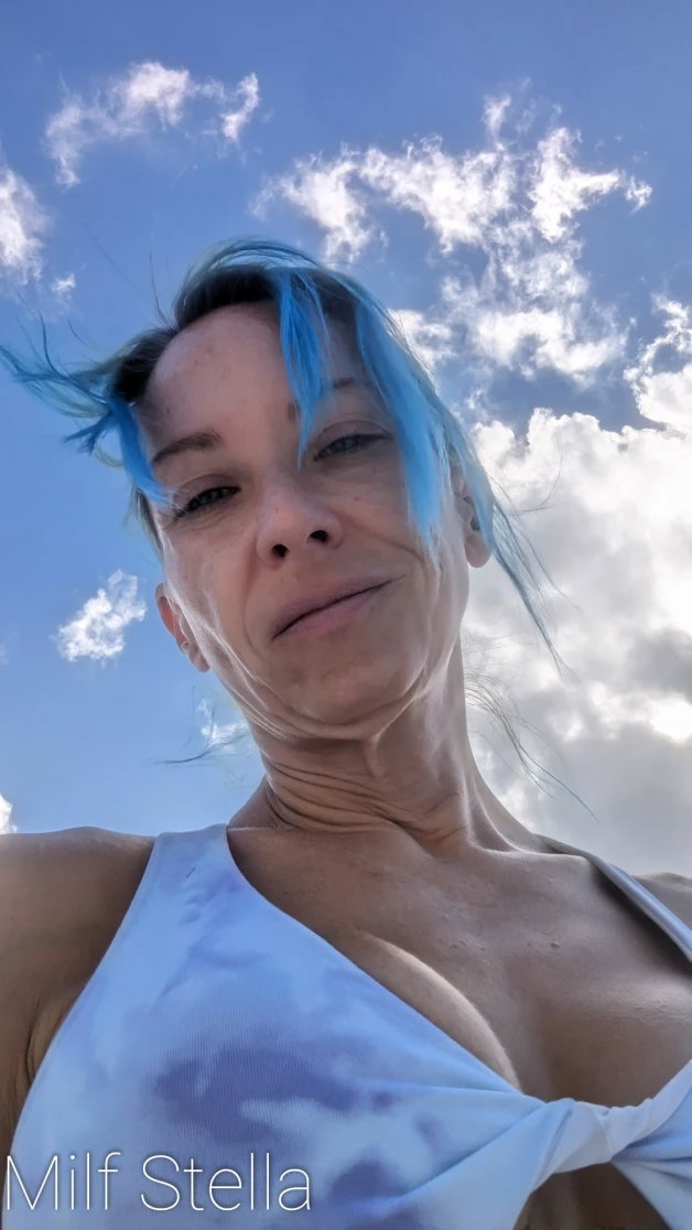 Photo by SexWithMilfStella with the username @SexWithMilfStella, who is a star user,  April 20, 2024 at 1:50 PM and the text says 'Enjoying the sky today! #stellahere #petite #blueeyes #bluehair #sky #clouds'