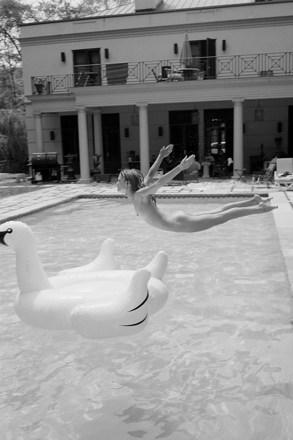 Photo by MaxvJ with the username @MaxvJ,  August 17, 2013 at 2:48 PM and the text says '#girl  #girly  #wather  #nude  #Black  #and  #White  #sexy  #pool  #jump  #hot  #fly  #flying'