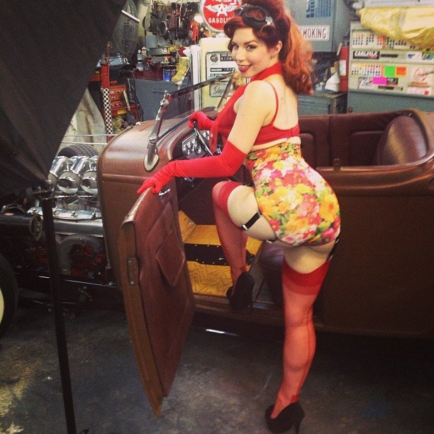 Photo by Roperigger76 with the username @Roperigger76,  August 26, 2013 at 10:29 PM and the text says 'ludellahahn:

Just finished shooting with Dennis Simone at Hollywood Garage (recently featured on American Pickers) #sneakpeek #bts #pinup #retro #redhead #stockings #kissmedeadly #ludellahahn #photoshoot #booty #hotrod'