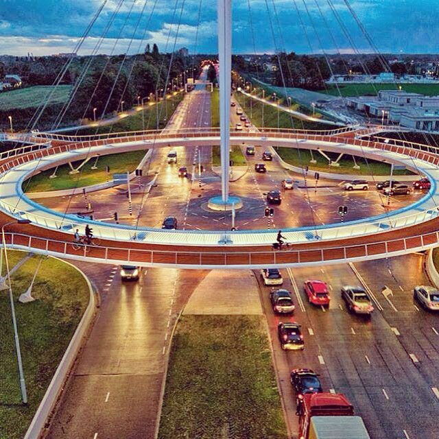 Photo by misfetiches with the username @misfetiches,  July 9, 2017 at 10:05 AM and the text says 'markedrianandree:

Floating bike suspension bridge,  #hovenring #Eindhoven #Netherlands #bridge #floating #bike #amazing'