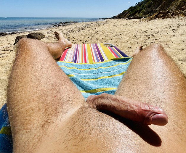 Photo by OzNudeUncut with the username @OzNudeUncut, who is a verified user,  May 31, 2022 at 11:43 PM. The post is about the topic Gay nude beach and the text says 'Getting hard at the nude beach
#nudebeach #beachboner #uncut'