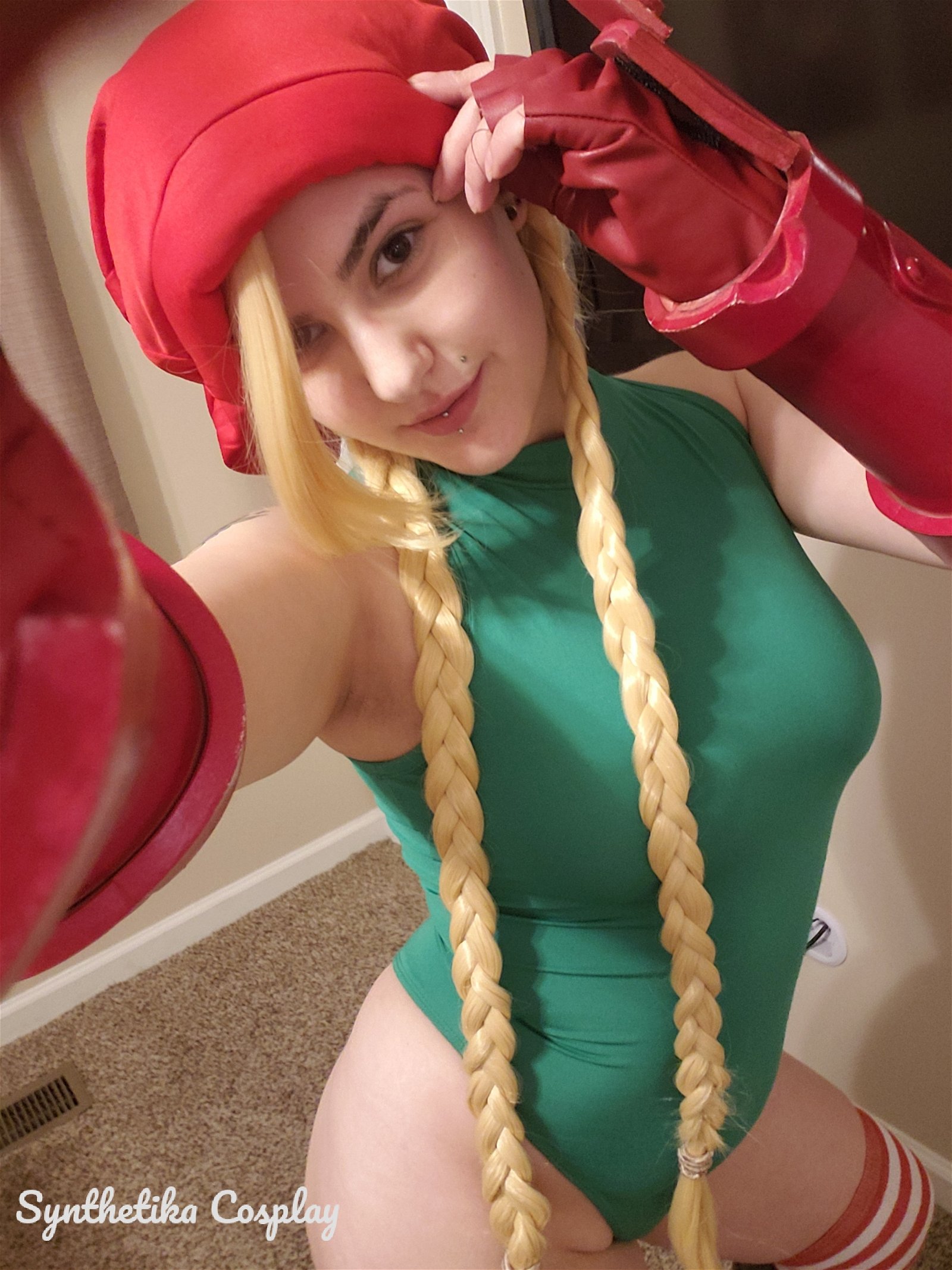 Photo by SynthetikaCosplay with the username @SynthetikaCosplay, who is a star user,  December 13, 2018 at 3:24 AM. The post is about the topic Cosplay and the text says 'Would you kiss Christmas elf Cammy underneath the mistletoe?
🍭🍭🍭🍭'