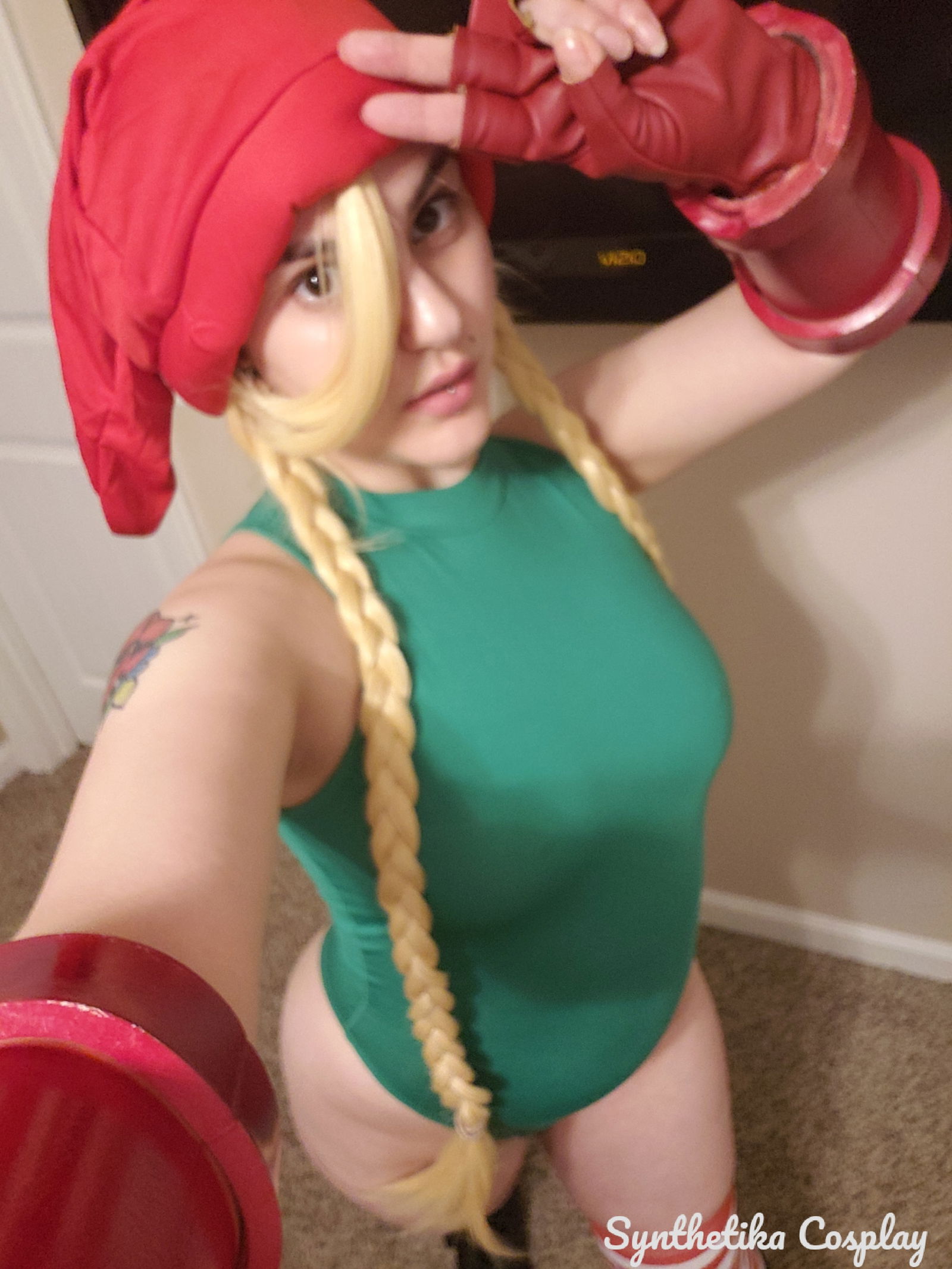 Album by SynthetikaCosplay with the username @SynthetikaCosplay, who is a star user,  December 13, 2018 at 3:24 AM. The post is about the topic Cosplay and the text says 'Would you kiss Christmas elf Cammy underneath the mistletoe?
🍭🍭🍭🍭'