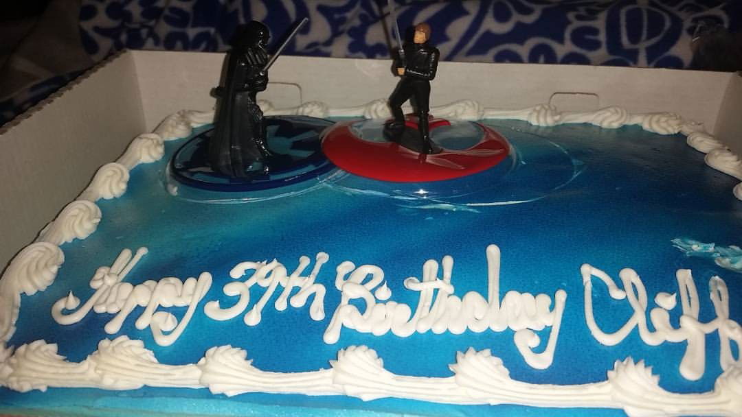 Photo by Mike Hawke with the username @wunhunglow410, who is a verified user,  December 21, 2015 at 11:58 PM and the text says 'Darth Vader vs Luke Skywalker on my cake for turning 39 yrs old today. Man I love watching Star Wars.
#darthvadervslukeskywalker #starwars #darksidevslightside #realtalk #darthvader #lukeskywalker  (at Dragon Man&rsquo;s World) #darthvadervslukeskywalker ..'