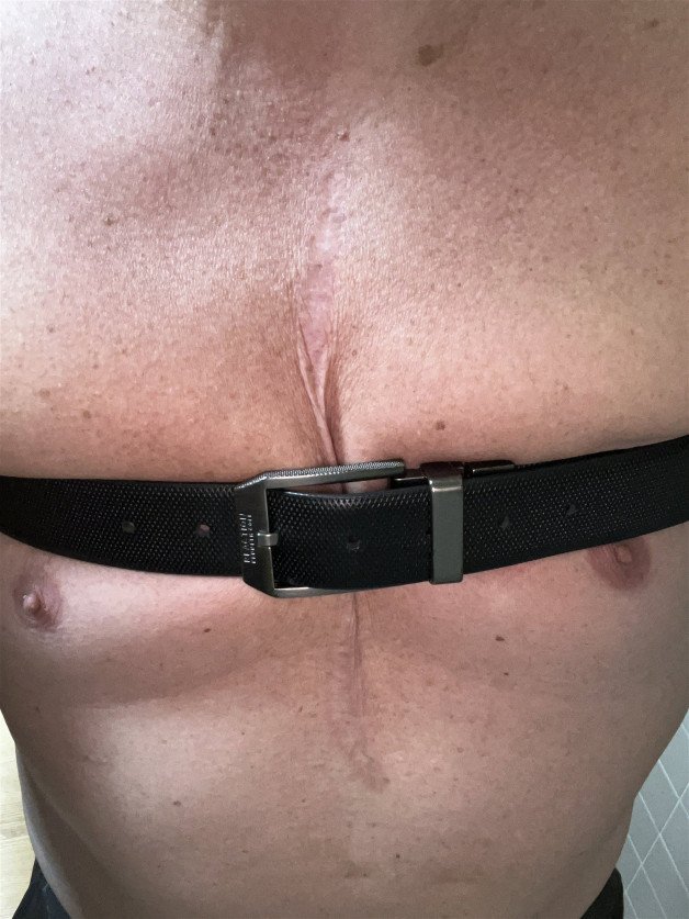 Photo by Subguy01 with the username @Artsyguy, who is a verified user,  July 16, 2024 at 12:36 PM and the text says 'stripped on cam in a work bathroom and told to post my belt restraint picture'