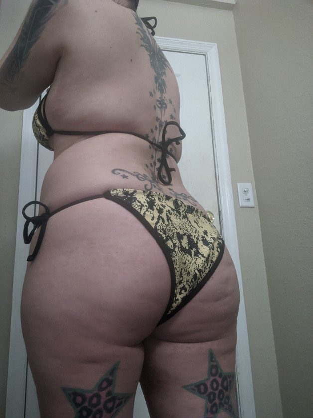 Photo by VesperaSage with the username @VesperaSage, who is a star user,  July 6, 2023 at 8:38 PM and the text says 'Which bikini is your fave? #bikini #tattoos #thick'