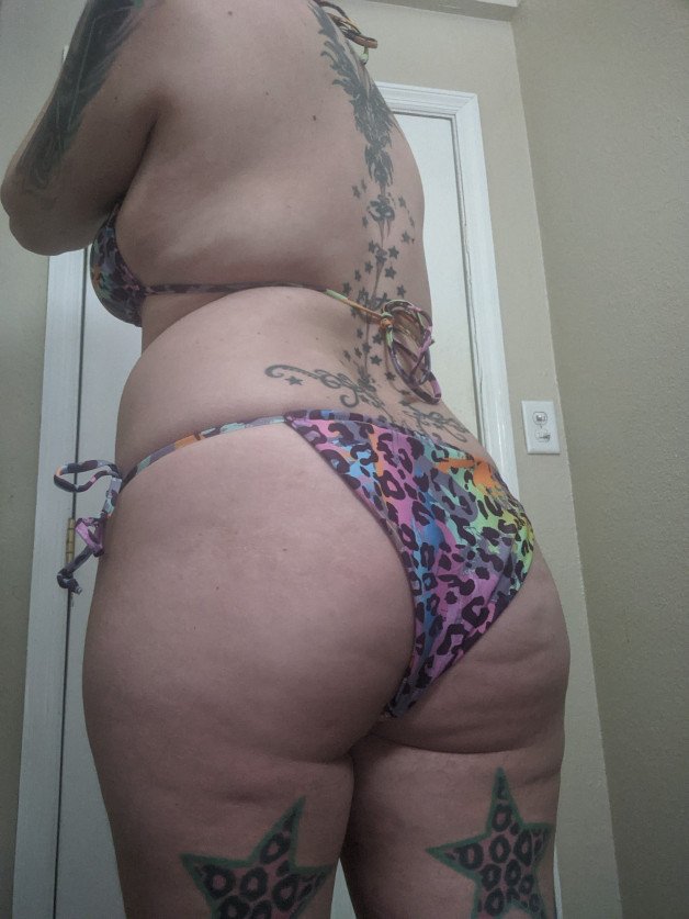 Album by VesperaSage with the username @VesperaSage, who is a star user,  July 6, 2023 at 8:38 PM and the text says 'Which bikini is your fave? #bikini #tattoos #thick'