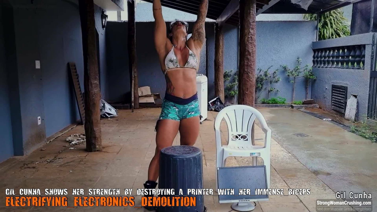 Album by MusclegirlStrength with the username @MusclegirlStrength, who is a brand user,  October 8, 2023 at 1:41 PM and the text says '🔥💪 Ready to witness pure power? Join us at www.strongwomancrushing.com and watch Gil Cunha unleash her strength as she obliterates a printer with her massive biceps! 💥🖨️ Don't miss out on this jaw-dropping display of female strength! 💪🔥..'