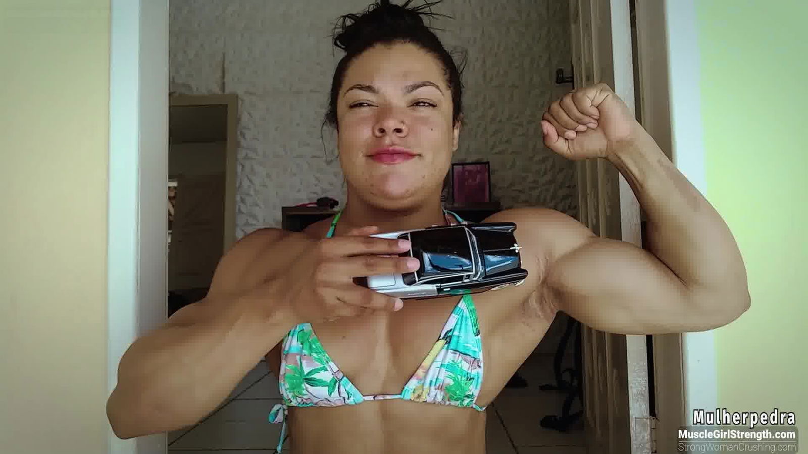 Album by MusclegirlStrength with the username @MusclegirlStrength, who is a brand user,  April 18, 2024 at 3:44 PM and the text says 'Crushing Cars with Muscle Power: Watch Mulherpedra in Action!: StrongWomanCrushing.com

#musclegirl #musclegirllove #femalemuscle #femalemuscles #featsofstrength #MuscleQueen #PowerfulWomen #StrongAndSexy'