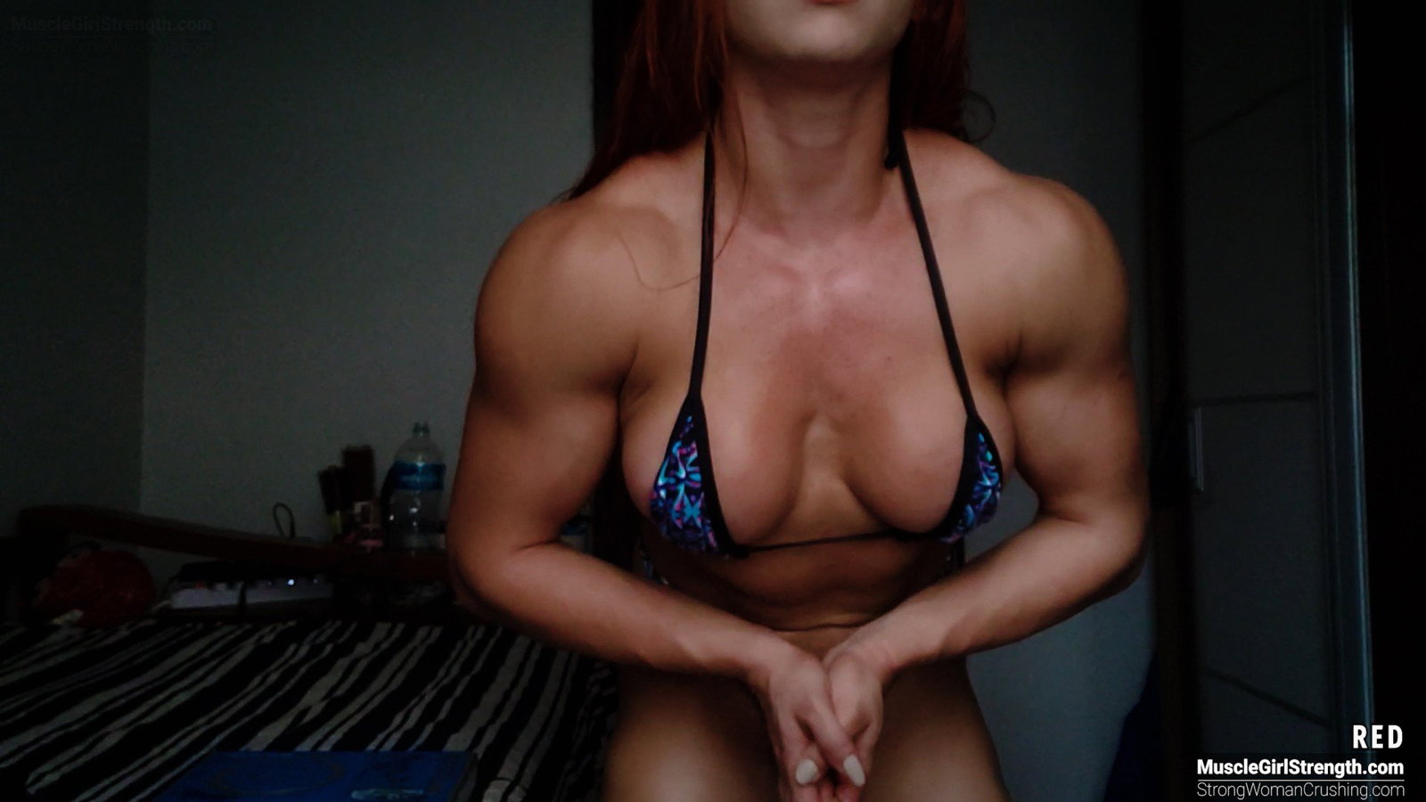 Photo by MusclegirlStrength with the username @MusclegirlStrength, who is a brand user,  May 22, 2023 at 5:12 PM and the text says '💪😍 Link:
https://www.strongwomancrushing.com/2020/11/06/red-obliterates-a-mini-dvd-with-her-might-muscles/

RED obliterates a mini DVD with her might muscles

RED uses her superior strength and muscular body to destroy an old mini DVD player -..'