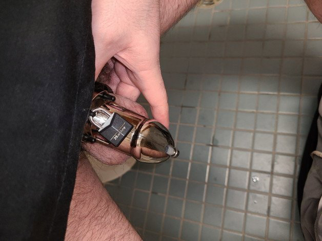 Photo by GayKinky with the username @GayKinky, who is a verified user, posted on May 8, 2022 and the text says '#Chastity at work'