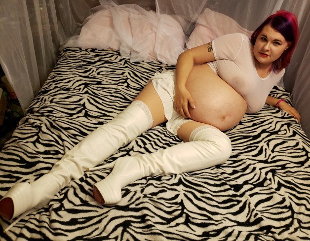 Album by Fenrir with the username @thor2347, who is a verified user,  April 27, 2021 at 11:23 AM. The post is about the topic Pregnant and the text says 'like and share my wife, who doesn't love a woman in thigh high boots. Like and share'