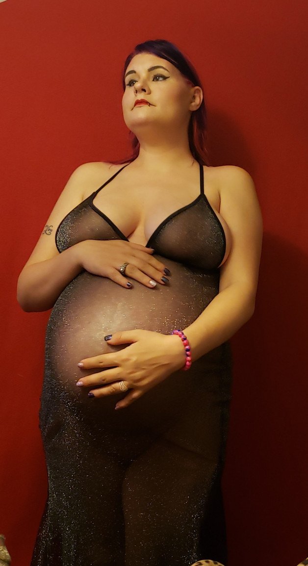 Album by Fenrir with the username @thor2347, who is a verified user,  April 23, 2021 at 2:44 AM. The post is about the topic See Through and the text says '@playfulkitten feeling sexy with her pregnant body'