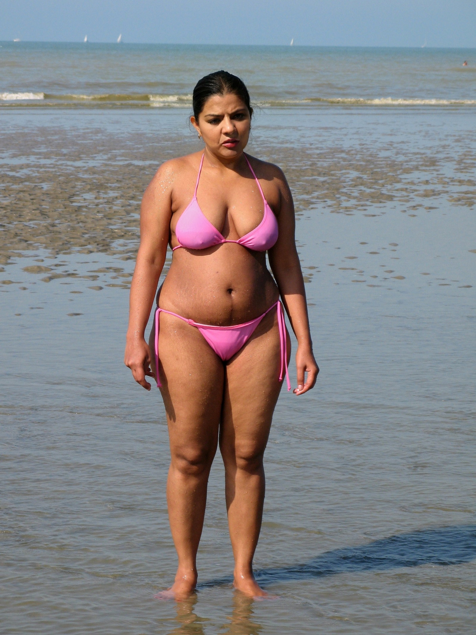 Photo by CaliStepmilf with the username @CaliStepmilf,  December 1, 2020 at 6:00 PM. The post is about the topic MILF and the text says 'This is her first time wearing a two piece bikini especially on a public beach. She wasn't too happy to stand there and pose for me. Hot no? What you guys think? #milf #stepmom #bikini'